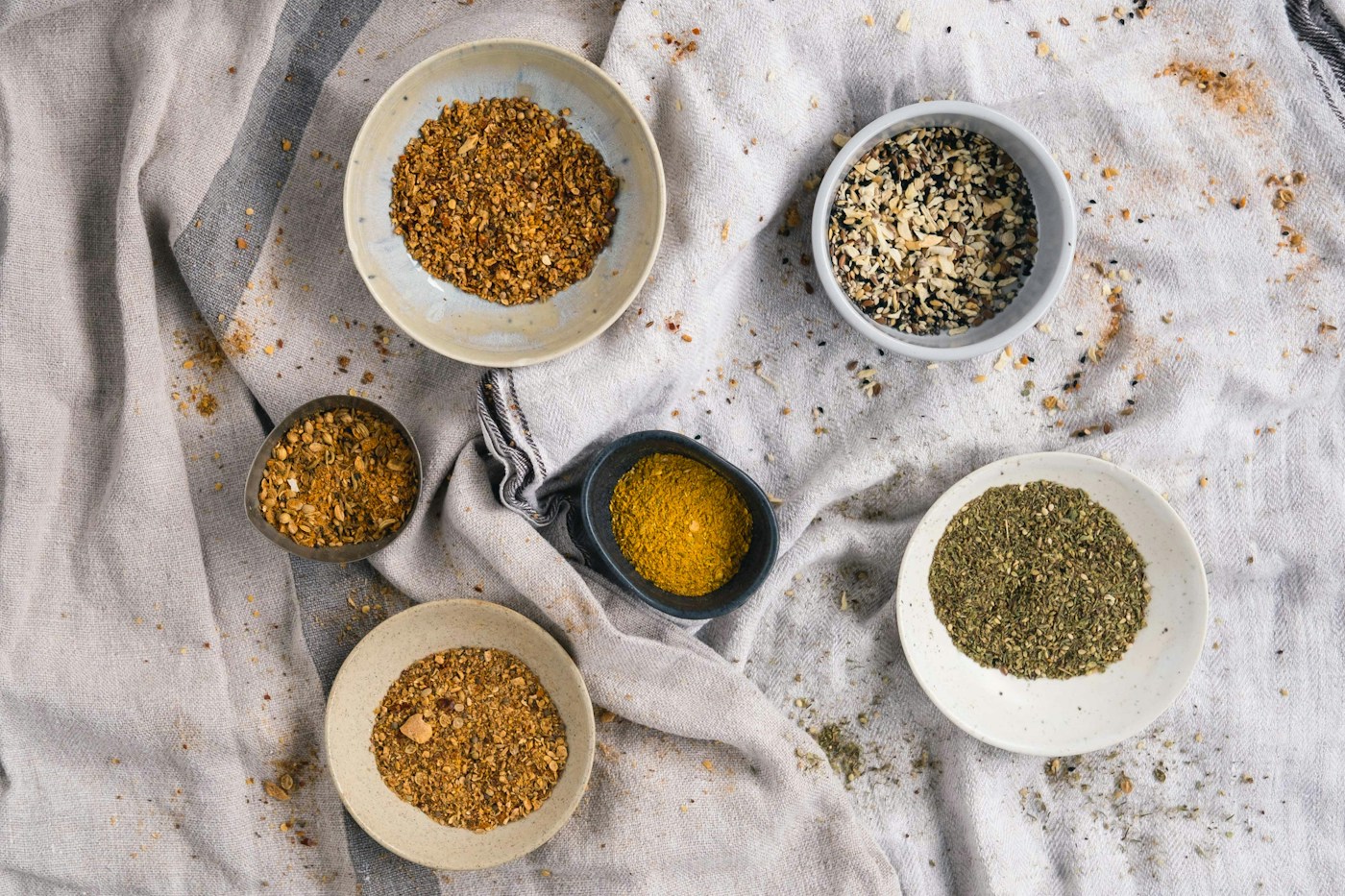 Illustrative photograph of spices in ceramic bowls